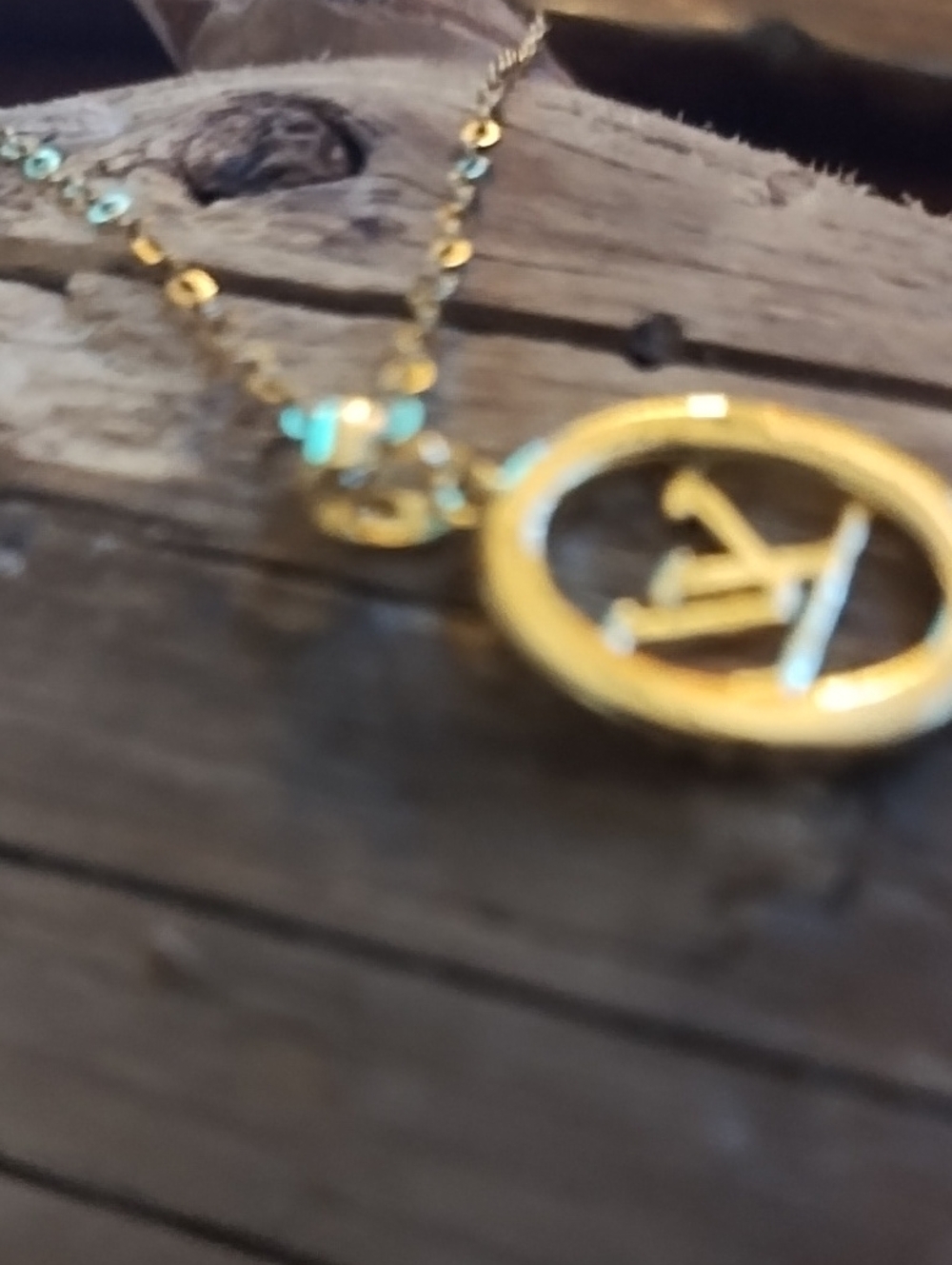 Small Gold Tone Logo Pendant Necklace